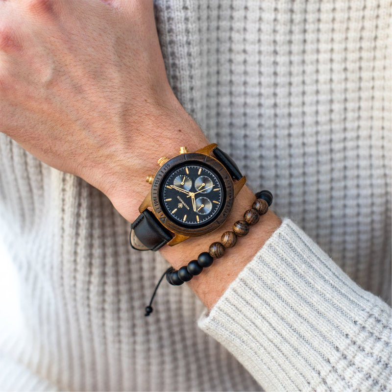 The CHRONUS Cosmic Night Jet features a classic SEIKO VD54 chronograph movement, scratch resistant sapphire coated glass and stainless steel enforced strap links. The watch is made of black sandalwood and has a black dial with golden details. Handcrafted